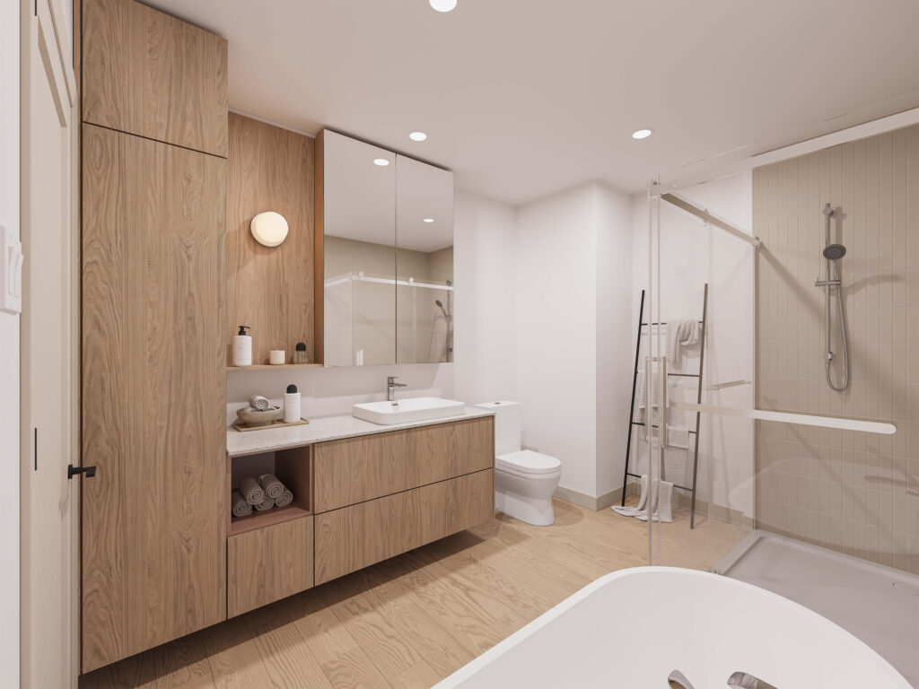 Salle de bain avec vanité en bois et douche vitrée d’une maison de ville au Patriote